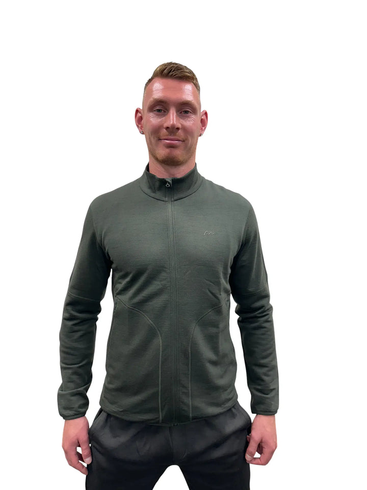 A dark grey/olive merino wool fleece zip jacket on a mannequin, showing the full zip and high neck collar.