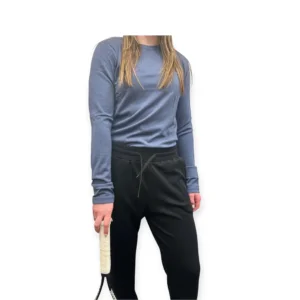 Navy Merino wool pants for women with soft stretch fabric, offering breathable comfort for travel, hiking, and everyday wear